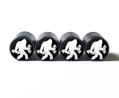 Bigfoot Sasquatch with Dumbbells Tire Valve Caps - Black Aluminum - Set of Four