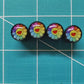 Rainbow Daisy Smiley Face Tire Valve Caps - Black Aluminum - Set of Four